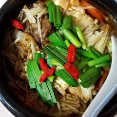 A picture of Beef, napa and enoki mushrooms stew.