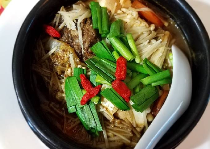 Beef, napa and enoki mushrooms stew