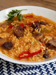 Una foto de Arroz con magret de pato
