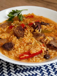 Una foto de Arroz con magret de pato