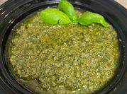 A picture of pesto of basil and pine nuts
