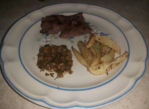 Una foto de Filete al perejil con papas rústicas