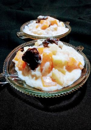 Una foto de Arroz meloso con frutas🍎 🍊🎃