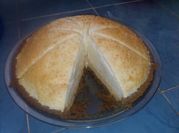 Una foto de pay de queso requeson