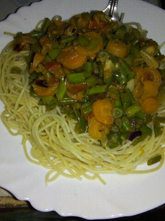 A picture of Spaghetti with stir fried French beans.
