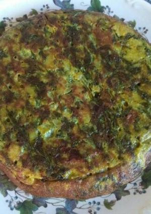 Una foto de Tortilla de espinacas, cebolla y patata