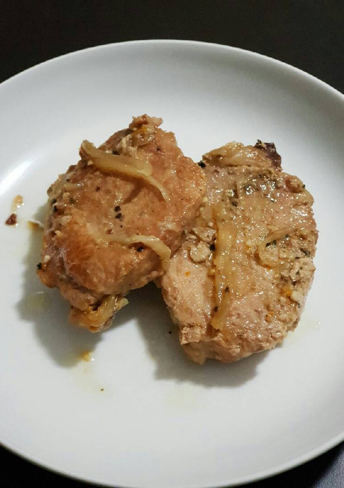 Una foto de Lomo con cebolla y chile morrón