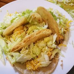A picture of Crockpot Chicken Tacos in a Crispy Shell.