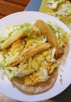 A picture of Crockpot Chicken Tacos in a Crispy Shell.