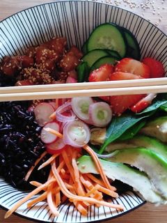 A picture of Poke Bowl with Black Rice, Fresh Salmon, Avocado, and Strawberries.