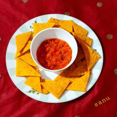 A picture of Nachos with Roasted Tomato Salsa.