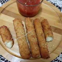 A picture of Cheddar cheese sticks.