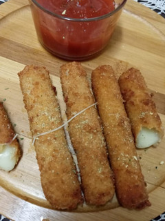 A picture of Cheddar cheese sticks.