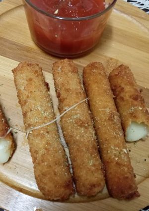 A picture of Cheddar cheese sticks.