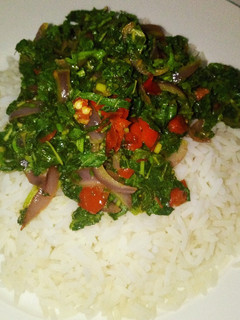 A picture of Steamed white rice with stir fried Green.
