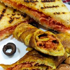 A picture of Crispy carrot bread sandwich & carrot egg rolls.