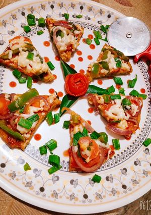 A picture of Moong dal cheese pizza.