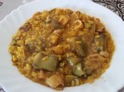 Una foto de arroz meloso con fumet