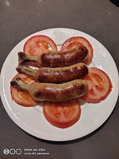 A picture of Pork Sausage with Tomato.