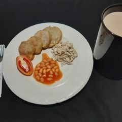 A picture of Golden yam, scrambled egg and baked beans.
