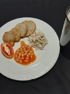 A picture of Golden yam, scrambled egg and baked beans.