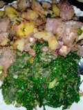 Fried nduma with beef and potato served. with spinach