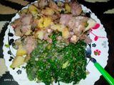 Fried nduma with beef and potato served. with spinach