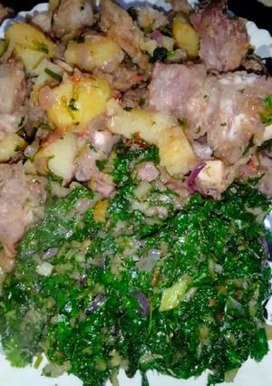 A picture of Fried nduma with beef and potato served. with spinach.