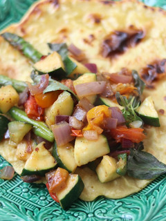 A picture of Farinata pancake with harissa spiced mixed vegetable 🥞.