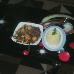 A picture of Beef stew with tumeric rice.
