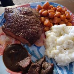 Seasoned Swiss Steak w/ Glazed Carrots and Ranch Mashed Potatoes A picture of Seasoned Swiss Steak w/ Glazed Carrots and Ranch Mashed Potatoes.