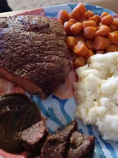 A picture of Seasoned Swiss Steak w/ Glazed Carrots and Ranch Mashed Potatoes.