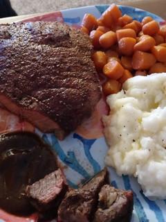 A picture of Seasoned Swiss Steak w/ Glazed Carrots and Ranch Mashed Potatoes.