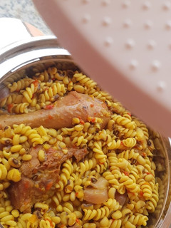 A picture of Macaroni and Beans Jollof, with Chicken😍.