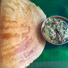 A picture of Broken wheat dosa with cashew mint chutney.