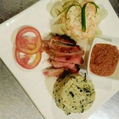 A picture of Rice,coleslaw with stew.