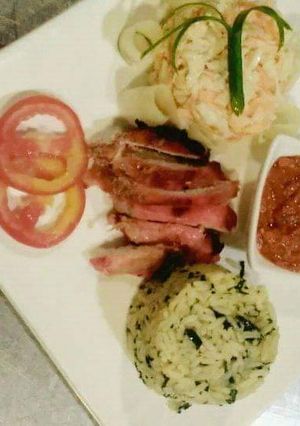 A picture of Rice,coleslaw with stew.