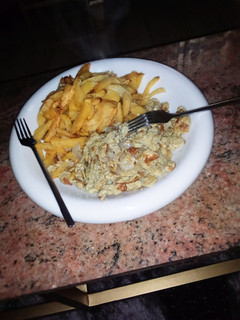 A picture of Irish potatoe with scrambled egg.