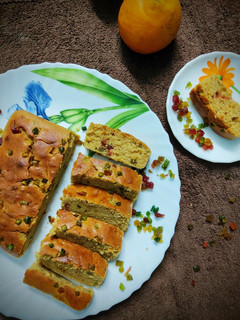 অরেঞ্জ টুটি ফ্রুটি এগলেস কেক (orange trutti fruti Eggless cake recipe n Bengali) রেসিপির প্রধান ছবি