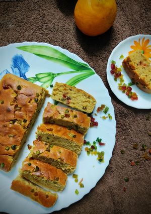 অরেঞ্জ টুটি ফ্রুটি এগলেস কেক (orange trutti fruti Eggless cake recipe n Bengali) রেসিপির প্রধান ছবি