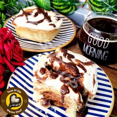 A picture of Cinnamon Roll Or Bun Or Swirl Homemade Easy Recipe With Buttercream And Chocolate Frosting.