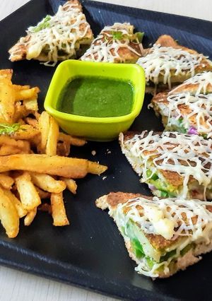 A picture of Veg cheese Grilled with Fries.