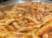 A picture of penne pasta and sausage