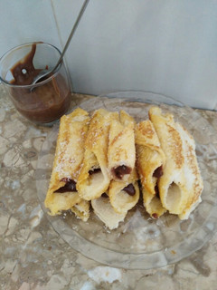 Una foto de Rollitos de Pan de molde relleno de chocolate casero sin azúcar