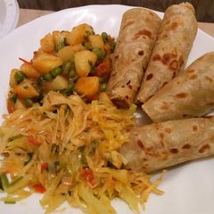 A picture of Potato stew with chapati.