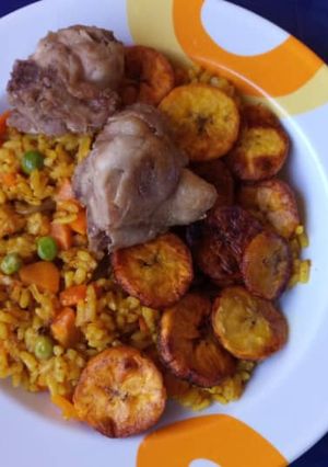 A picture of Jollof rice with fried plantain.