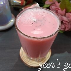 A picture of Pink Lassi with Basil Seeds.