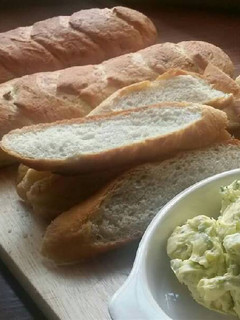 A picture of Homemade Baguettes with Garlic Dill Butter.