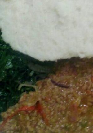 A picture of Minced meat with kales and ugali.