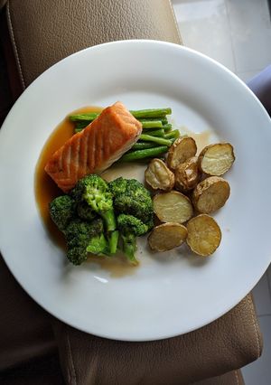 A picture of Pan Fried Salmon with Vegetables and Roasted Potatoes.
